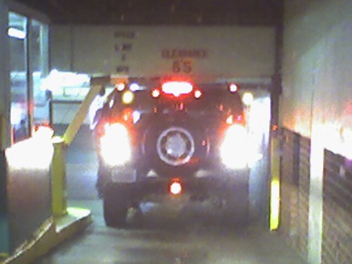 Hummer stuck in a parking garage